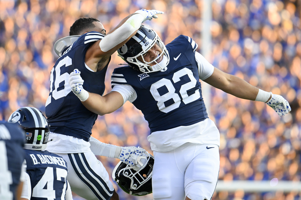 BYU tight end Noah Moeaki (82) celebrates with teammate Isaiah Glasker (16) after scoring a touchdown during the first half of an NCAA college football game against Portland State, Saturday, Aug. 30, 2025 in Provo. (AP Photo/Alex Goodlett)