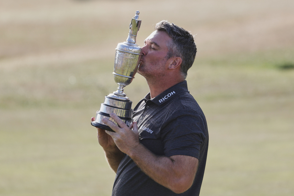 Ryan Fox of New Zealand kisses the trophy as he poses for the media with the Claret Jug trophy after winning the British Open Golf championships at Royal Birkdale golf club, in Southport, England, Sunday, July 19, 2026. (AP Photo/Peter Morrison)
