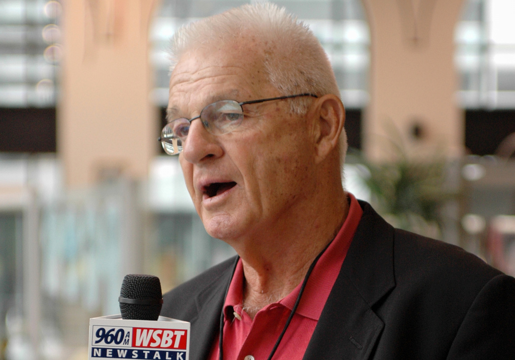 FILE - Paul Wiggin, defensive tackle for Stanford 1954-56, talks to a local radio station at a reception for players being enshrined into the College Football Hall of Fame, Aug. 10, 2006, in South Bend, Ind. (AP Photo/Joe Raymond, File)