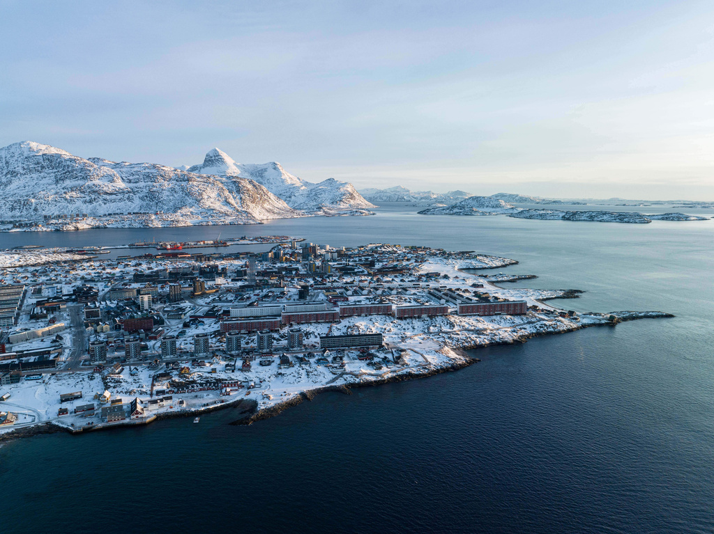 Houses are seen near the coast of a sea inlet of Nuuk, Greenland, on Sunday, Jan. 25, 2026. (AP Photo/Evgeniy Maloletka)