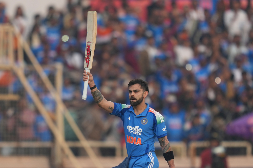 India's Virat Kohli celebrates his century during the first One Day International match between India and South Africa in Ranchi, India, Sunday, Nov. 30, 2025. (AP Photo/Rafiq Maqbool)
