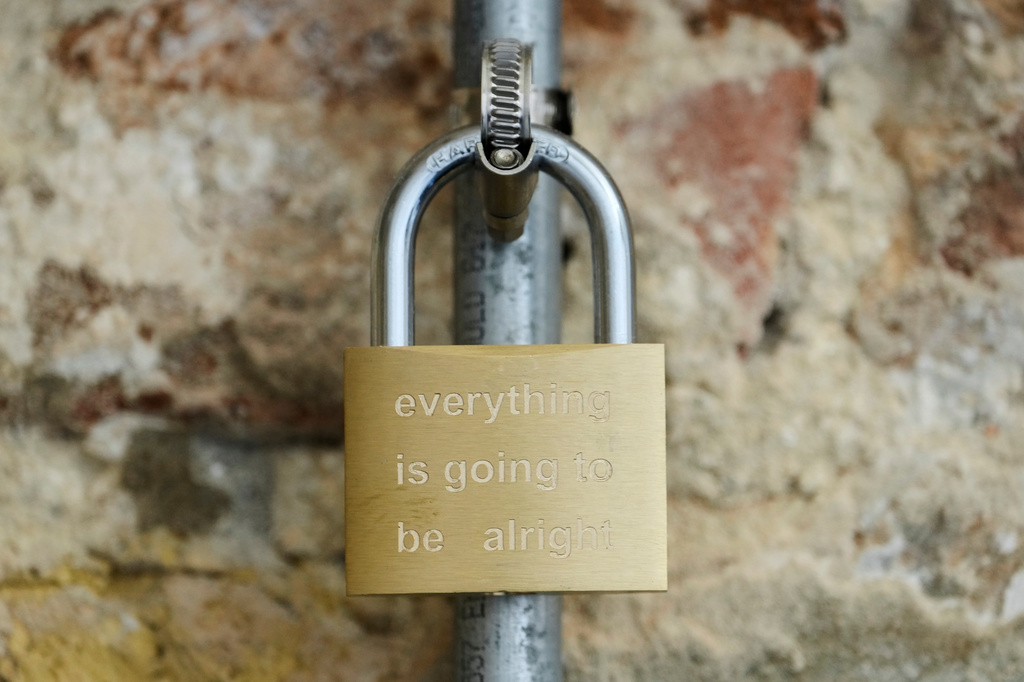 A padlock bearing inscriptions hangs from pipes inside the Israeli pavilion, which presents “Rose of Nothingness” by Belu-Simion Fainaru, during a preview of the 61st International Art Exhibition, the Venice Biennale, in Venice, Tuesday, May 5, 2026. (AP Photo/Luca Bruno)