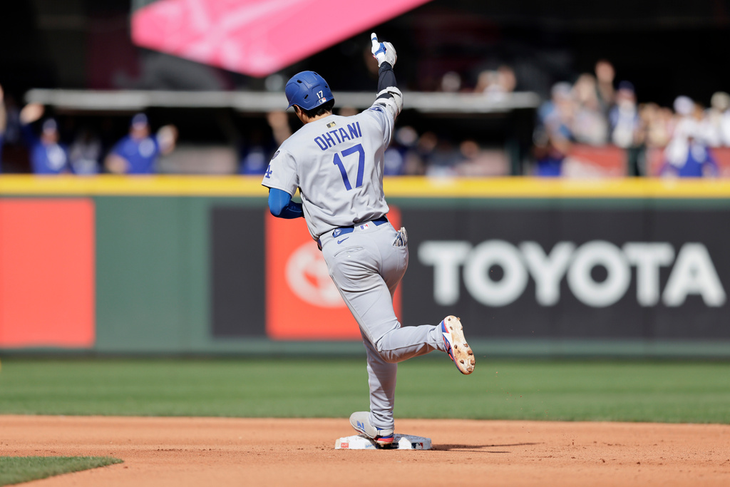 Los Angeles Dodgers' Shohei Ohtani rounds the bases on his solo home run off Seattle Mariners pitcher Caleb Ferguson during the seventh inning of a baseball game Sunday, Sept. 28, 2025, in Seattle. (AP Photo/John Froschauer)