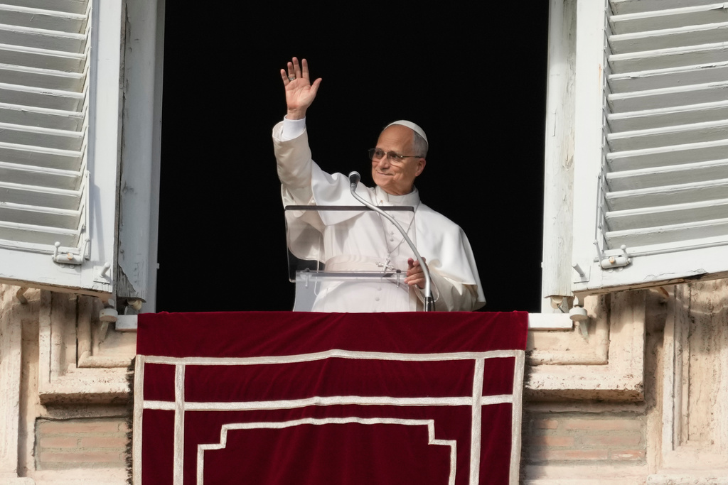 Pope Leo XIV delivers the Angelus noon prayer in St. Peter's Square, at the Vatican, Sunday, Dec. 21, 2025. (AP Photo/Gregorio Borgia)