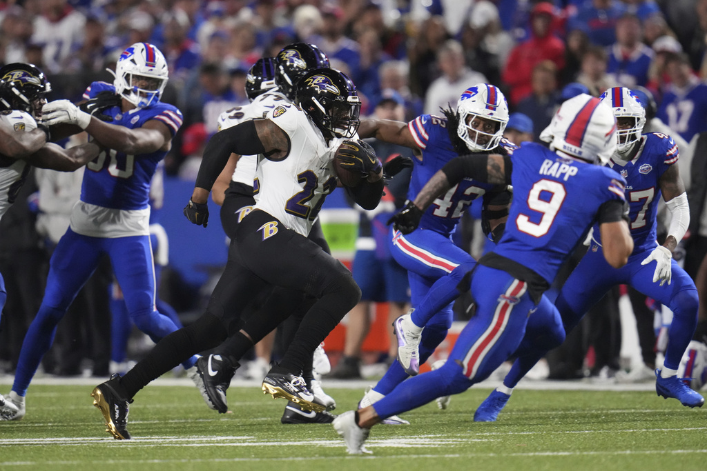 Baltimore Ravens running back Derrick Henry (22) runs for a touchdown against the Buffalo Bills during the second half of an NFL football game in Orchard Park, N.Y., Sunday, Sept. 7, 2025. (AP Photo/Gene J. Puskar)