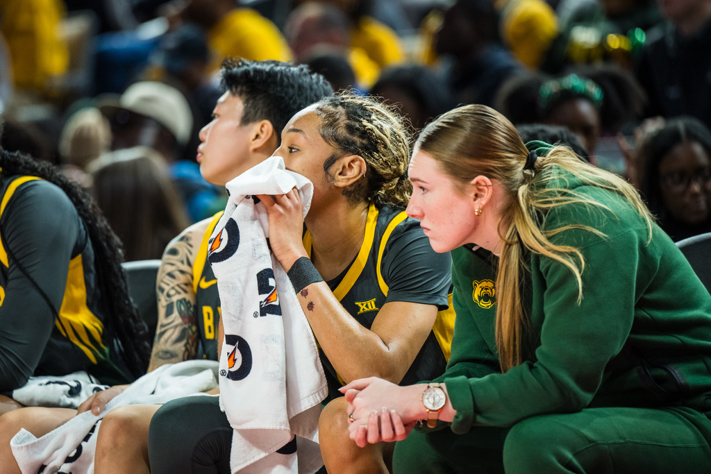 Baylor players on the bench react during an NCAA college basketball game against Texas, Sunday, Dec. 14, 2025, Fort Worth, Texas. (AP Photo/Jessica Tobias)