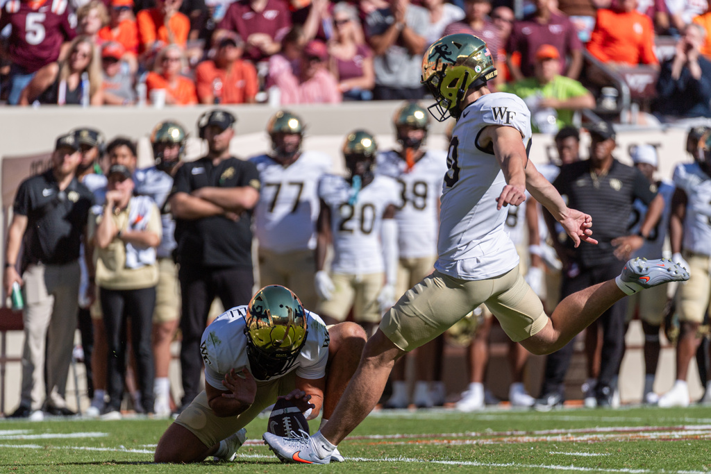 Wake Forest place kicker Connor Calvert (90) kicks a field goal against Virginia Tech during the second half of an NCAA college football game, Saturday, Oct. 4, 2025, in Blacksburg, Va. (AP Photo/Robert Simmons)