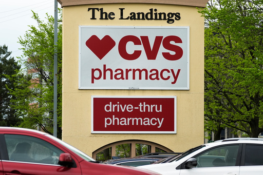 FILE - CVS pharmacy and drive-thru signs are seen outside of CVS store in Park Ridge, Ill., Monday, April 29, 2024. (AP Photo/Nam Y. Huh, file) FILE - CVS pharmacy and drive-thru signs are seen outside of CVS store in Park Ridge, Ill., Monday, April 29, 2024. (AP Photo/Nam Y. Huh, file)