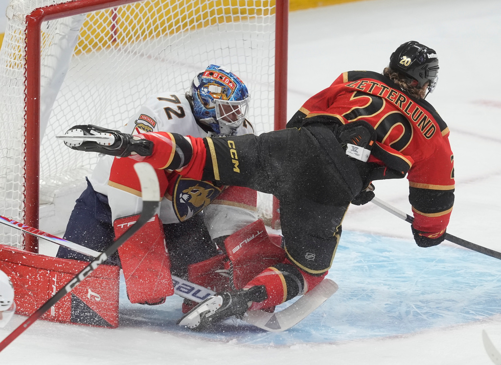 Ottawa Senators' Fabian Zetterlund (20) flies past Florida Panthers goaltender Sergei Bobrovsky (72) during first-period NHL hockey game action in Ottawa, Ontario, Thursday, April 9, 2026. (Adrian Wyld/The Canadian Press via AP)