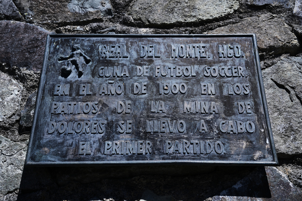 A plaque about soccer hangs on the wall of a home in Real del Monte, Hidalgo state, Mexico, Thursday, May 14, 2026. (AP Photo/Marco Ugarte)