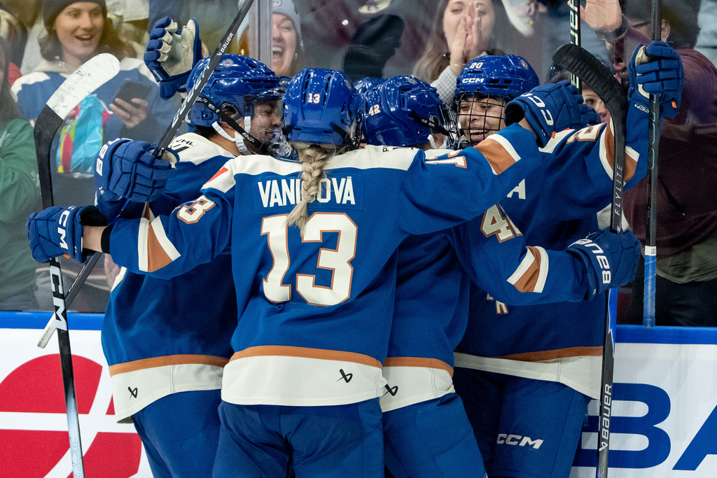 Vancouver Goldeneyes' Sarah Nurse (20) celebrates her goal against the Toronto Sceptres with her teammates during the third period of a PWHL hockey game in Vancouver, British Columbia, Thursday, Jan. 22, 2026. (Ethan Cairns/The Canadian Press via AP)