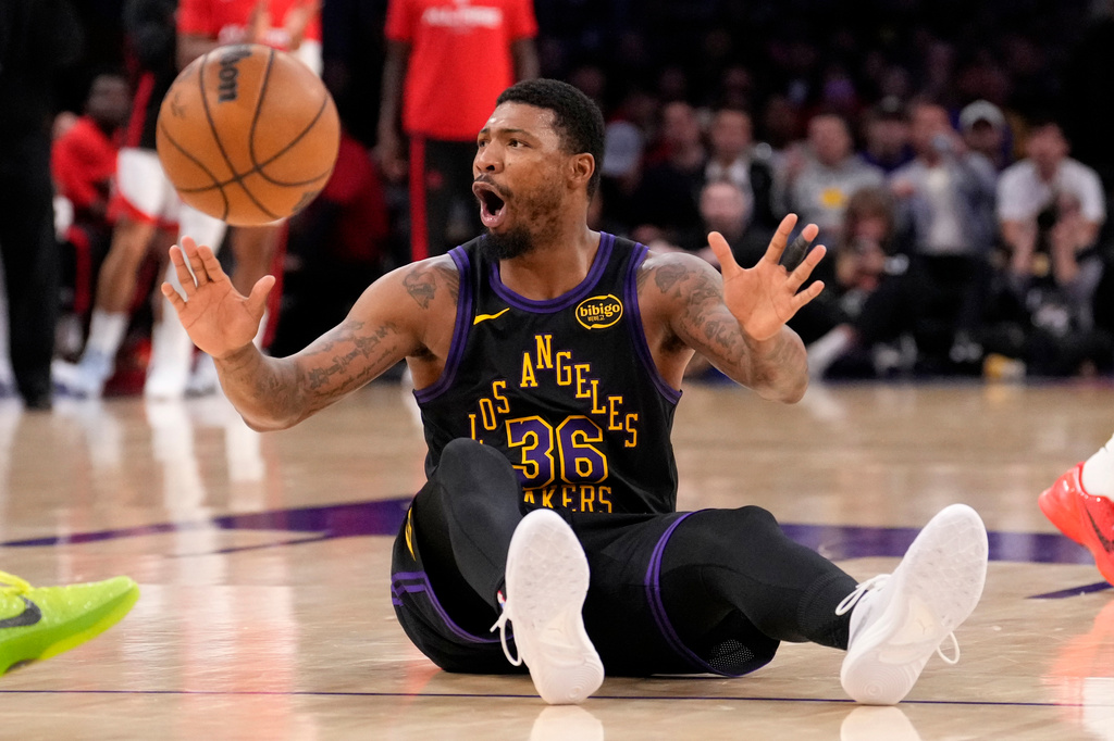 Los Angeles Lakers guard Marcus Smart reacts after being called for a foul during the first half in Game 2 of a first-round NBA playoffs basketball series against the Houston Rockets, Tuesday, April 21, 2026, in Los Angeles. (AP Photo/Mark J. Terrill)