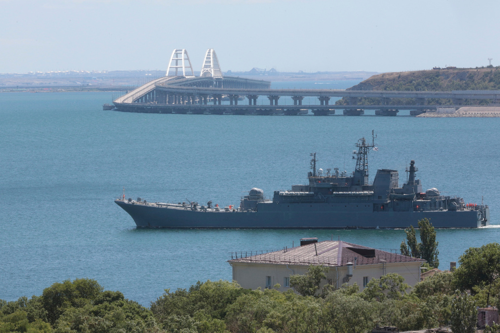FILE - A Russian military ship transports cars and people from the Russian mainland to the Crimean Peninsula over the Kerch Strait on Monday, July 17, 2023. (AP Photo, File)