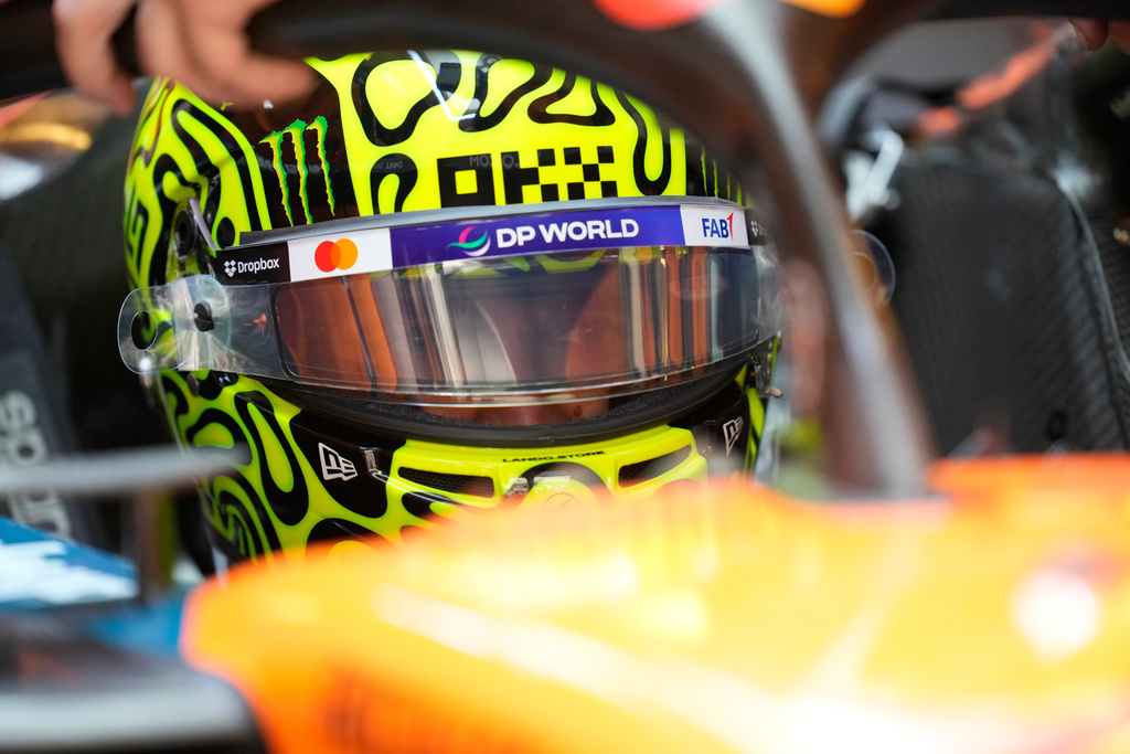 McLaren driver Lando Norris of Britain gets ready for the first practice for the he Abu Dhabi Formula One Grand Prix in Abu Dhabi, United Arab Emirates, Friday, Dec. 5, 2025. (AP Photo/Darko Bandic)