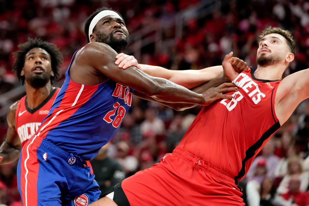 Detroit Pistons forward Isaiah Stewart, left, and Houston Rockets center Alperen Sengun, right, jostle for position during a free throw in the first half of an NBA basketball game Friday, Oct. 24, 2025, in Houston. (AP Photo/Eric Christian Smith)