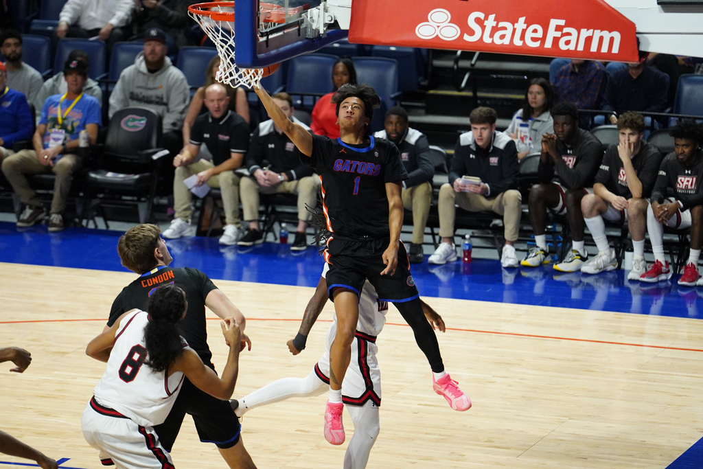 Florida guard Xaivian Lee (1) makes a layup on Saint Francis during the first half of an NCAA college basketball game Wednesday, Dec. 17, 2025, in Gainesville, Fla. (AP Photo/Morgan Hurd)