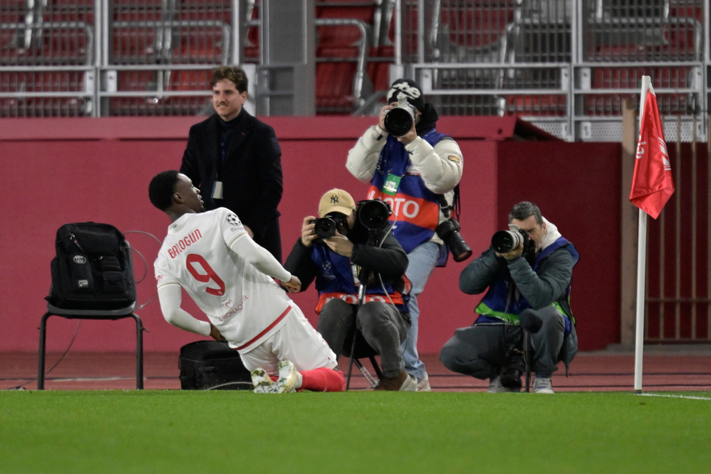 Monaco's Folarin Balogun celebrates after scoring the opening goal during the first-leg of the Champions League playoff soccer match between Monaco and Paris Saint-Germain in Monaco, Tuesday, Feb. 17, 2026. (AP Photo/Philippe Magoni)
