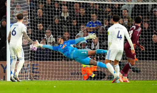 Leeds United's goalkeeper Lucas Perri dives in vain as West Ham United's Mateus Fernandes, right, scores their side's first goal during the English Premier League soccer match between Leeds United and West Ham United at Elland Road, Leeds, England, Friday Oct. 24, 2025. (Danny Lawson/PA via AP) Leeds United's goalkeeper Lucas Perri dives in vain as West Ham United's Mateus Fernandes, right, scores their side's first goal during the English Premier League soccer match between Leeds United and West Ham United at Elland Road, Leeds, England, Friday Oct. 24, 2025. (Danny Lawson/PA via AP)