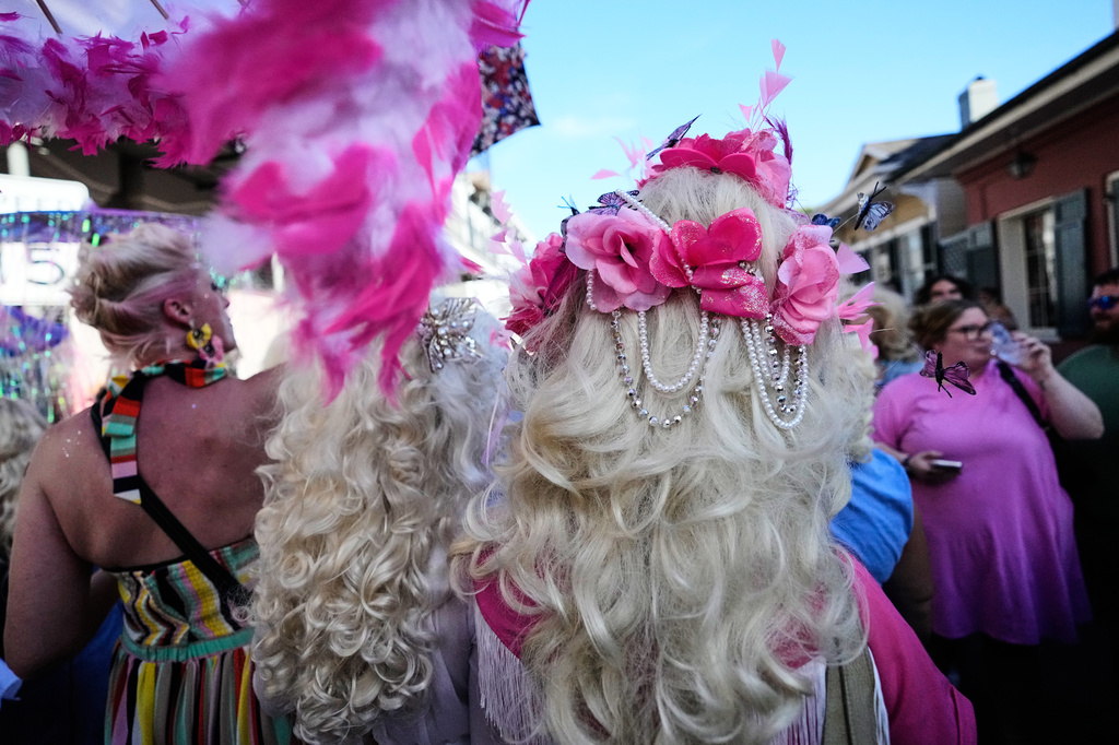 Members of the Krewe of Dolly lead a second line parade in commemoration of the life of Dolly Parton through the French Quarter Friday, Sept. 25, 2026, in New Orleans. (AP Photo/Gerald Herbert)