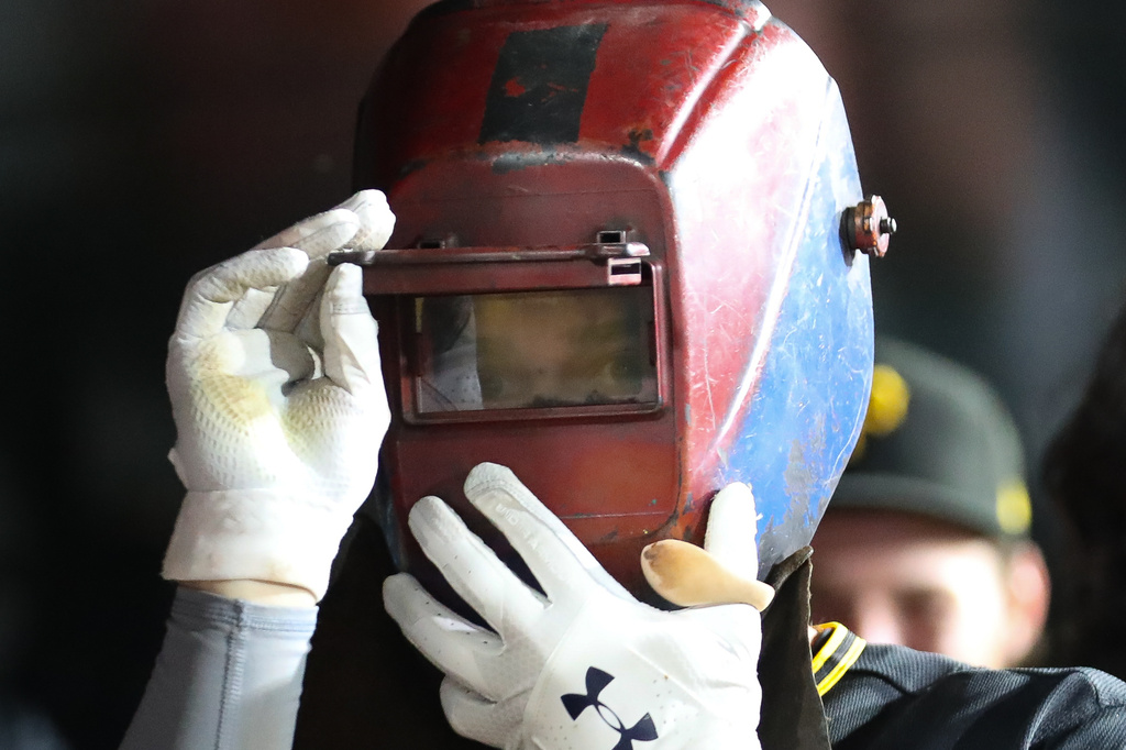 Pittsburgh Pirates' Brandon Lowe (5) celebrates in the dugout after hitting a solo home run during the ninth inning of a baseball game against the Athletics Tuesday, June 16, 2026, in West Sacramento, Calif. (AP Photo/Scott Marshall)