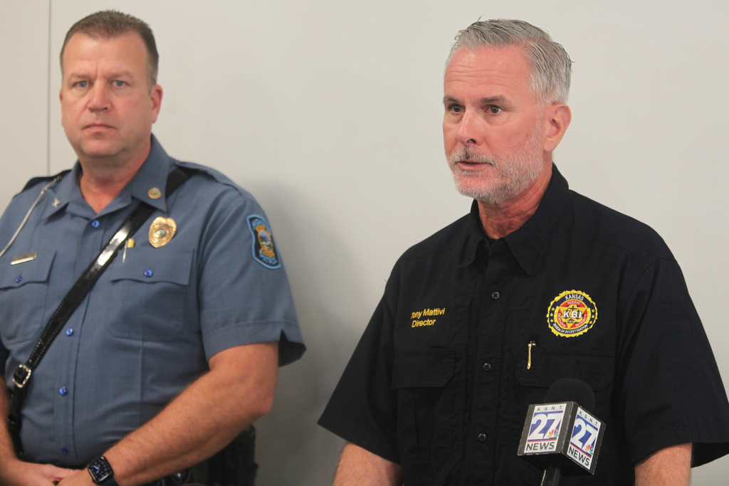 Kansas Bureau of Investigation Director Tony Mattivi, right, speaks at a news conference about a domestic violence incident that resulted in multiple casualties, Saturday, Nov. 15, 2025, at the Carbondale City Library in Carbondale, Kan. Kansas Highway Patrol Superintendent Erik Smith is seen standing left. (AP Photo/John Hanna)