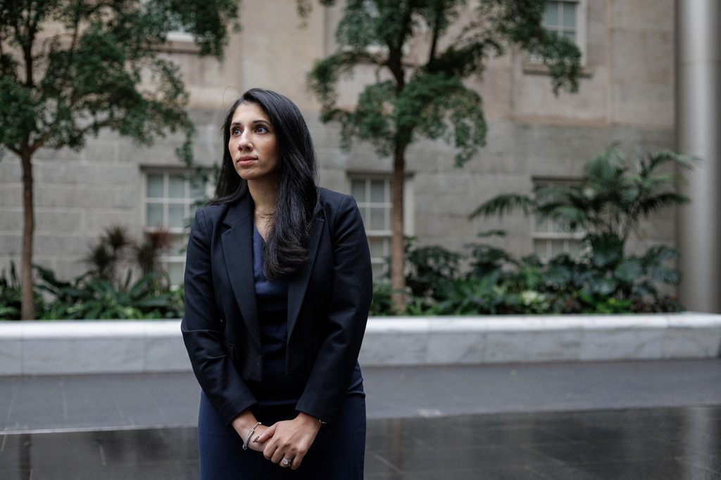 Anam Petit, a former Justice Department employee, poses for a portrait in the Robert and Arlene Kogod Courtyard at the National Portrait Gallery in Washington, Friday, Jan. 9, 2026. (AP Photo/Moriah Ratner)