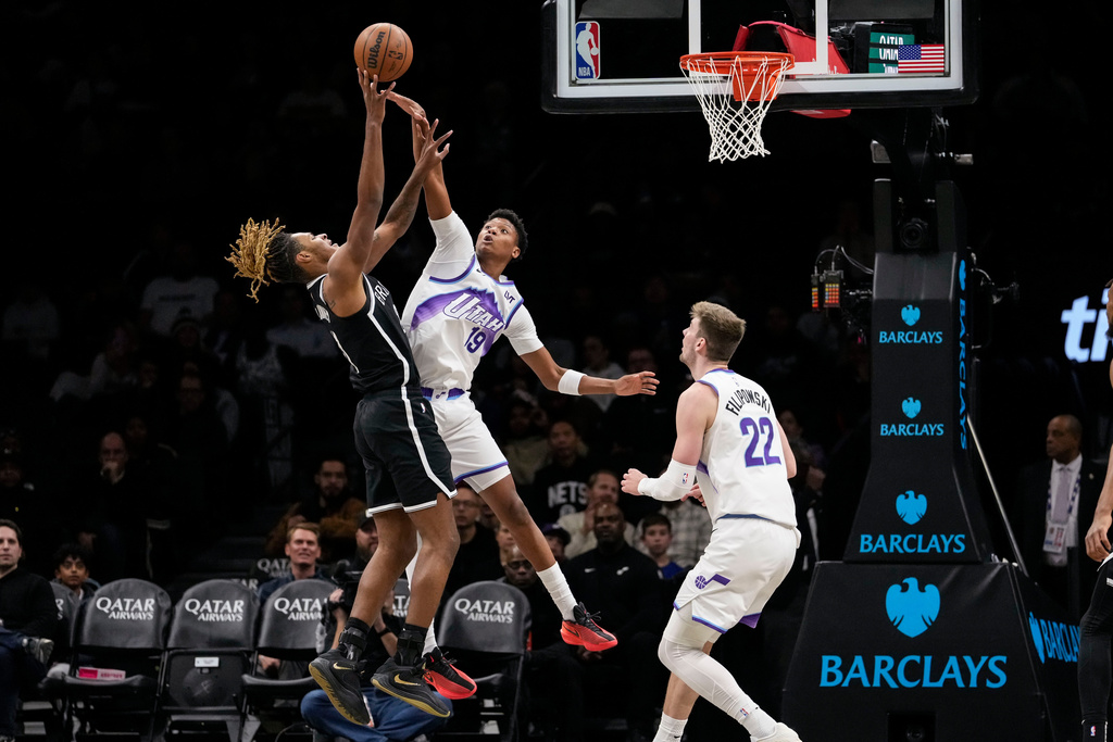Utah Jazz guard Ace Bailey (19) defends Brooklyn Nets forward Noah Clowney during the first half of an NBA basketball game, Thursday, Dec. 4, 2025, in New York. (AP Photo/Yuki Iwamura)