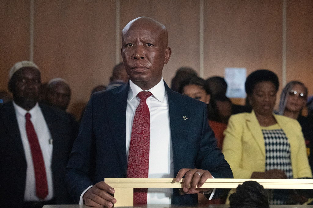 Julius Malema, Economic Freedom Fighters (EFF) party leader stands in the dock during his pre-sentencing hearing in court, East London, South Africa, Wednesday, April 15, 2026. (AP Photo/STR)