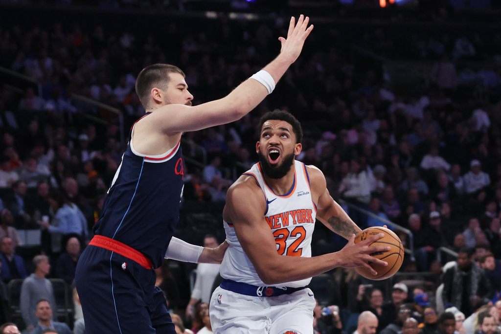 New York Knicks center Karl-Anthony Towns (32) drives to the basket while LA Clippers center Ivica Zubac defends during the second half of an NBA basketball game, Wednesday, Jan. 7, 2026, in New York. (AP Photo/Heather Khalifa)