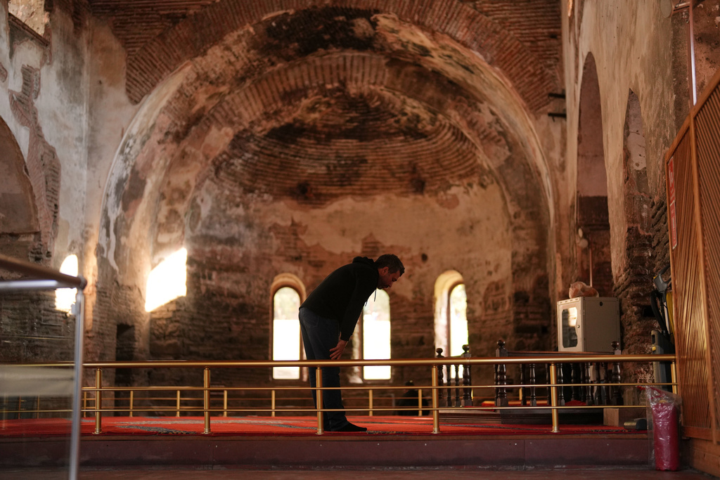 A Muslim prays at Hagia Sophia mosque, in Iznik, also known by its ancient name Nicaea, northwestern Turkey, Thursday, Nov. 13, 2025, ahead of the visit of Pope Leo XIV to the city to mark the 1,700th anniversary of the First Council of Nicaea. (AP Photo/Francisco Seco)