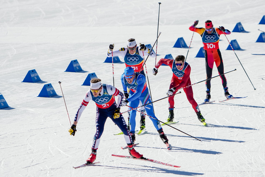 Ben Ogden, of the United States, from left, Elia Barp, of Italy, Johan Haeggstroem, of Sweden, Janik Riebli, of Switzerland, and Antoine Cyr, of Canada, compete in the cross-country skiing men's team sprint free at the 2026 Winter Olympics, in Tesero, Italy, Wednesday, Feb. 18, 2026. (AP Photo/Matthias Schrader)
