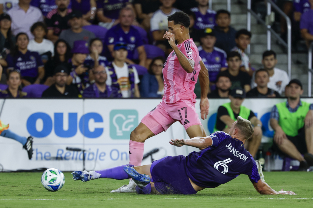 Orlando City defender Robin Jansson (6) kicks the ball away from Inter Miami defender Ian Fray (17) during the first half of an MLS soccer match, Sunday, Aug. 10, 2025, in Orlando, Fla. (AP Photo/Kevin Kolczynski)
