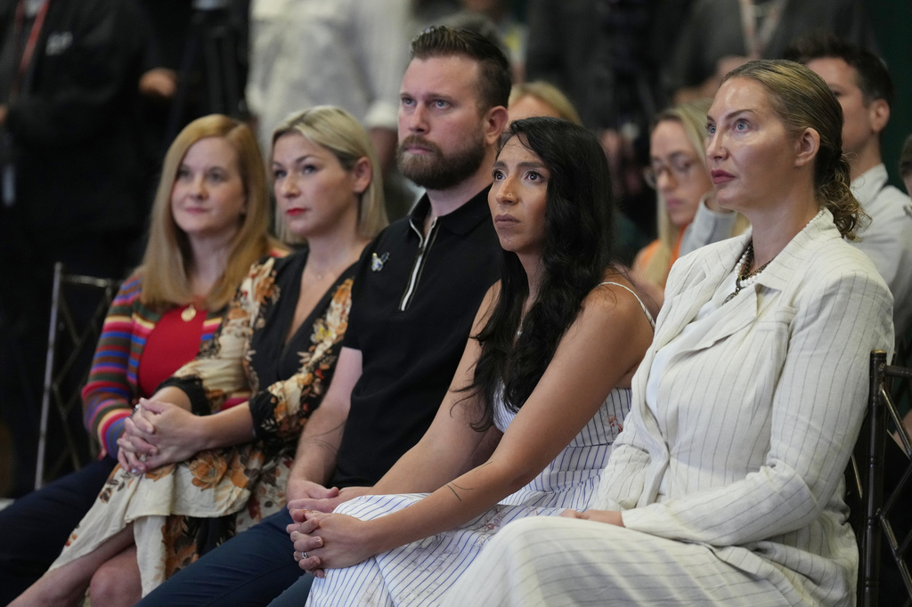 ADDS NAMES - Victims of Jeffrey Epstein sit in the front row, from left, Liz Stein, Dani Bensky, Sky Roberts, brother of a victim, Amanda Roberts, sister-in-law of a victim and Lara Blume McGee, as Democratic U.S. Senate candidate Texas state Rep. James Talarico speaks during an event in Dallas, Thursday, Sept. 10, 2026. (AP Photo/Jacquelyn Martin)