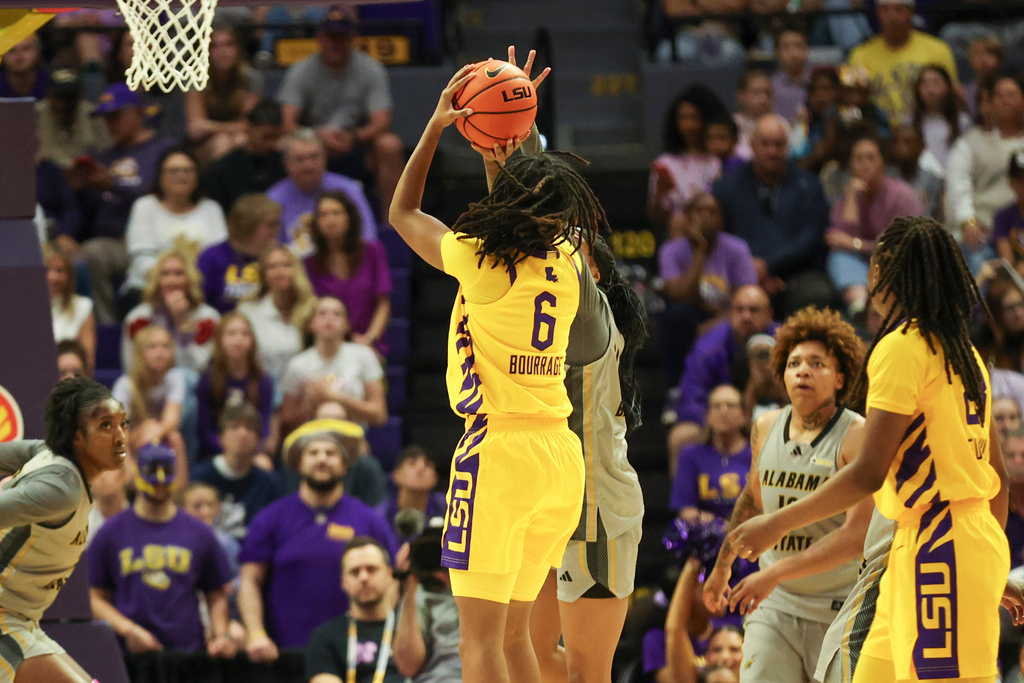 LSU guard Divine Bourrage (6) shoots a 3-point shot in the first half of an NCAA college basketball game against Alabama State in Baton Rouge, La., Sunday, Dec. 28, 2025. (AP Photo/Peter Forest)