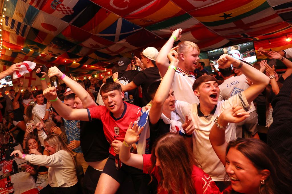 England supporters celebrate during the World Cup soccer match between England and Croatia at The Clock pub in Hebburn, England, Wednesday, June 17, 2026. (AP Photo/Scott Heppell)