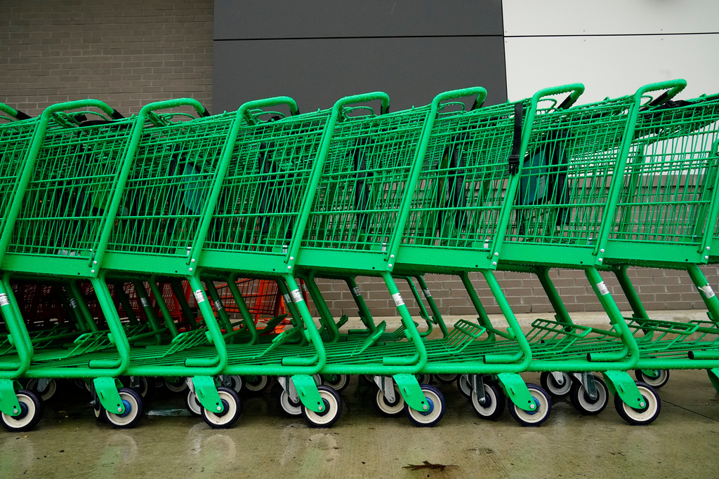 FILE - Shopping carts are positioned outside an Amazon Fresh grocery store in Warrington, Pa., Feb. 4, 2022. (AP Photo/Matt Rourke, File)