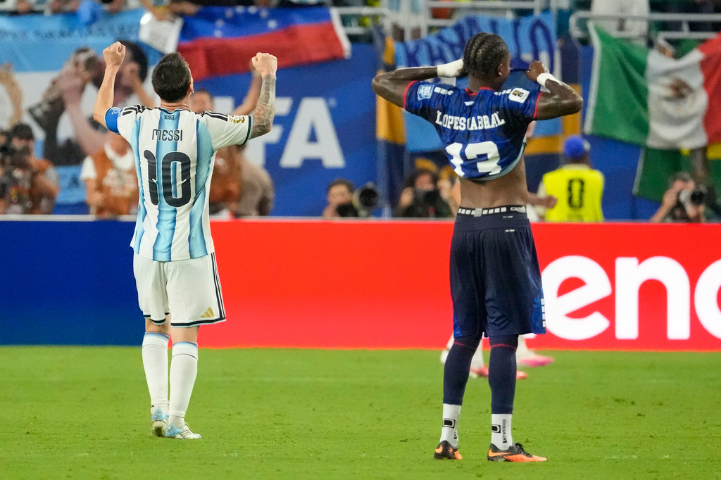 Cape Verde's Sidny Lopes Cabral (13) and Argentina's Lionel Messi (10) react after the World Cup round of 32 soccer match between Argentina and Cape Verde in Miami Gardens, Fla., Friday, July 3, 2026. (AP Photo/Chris Carlson)