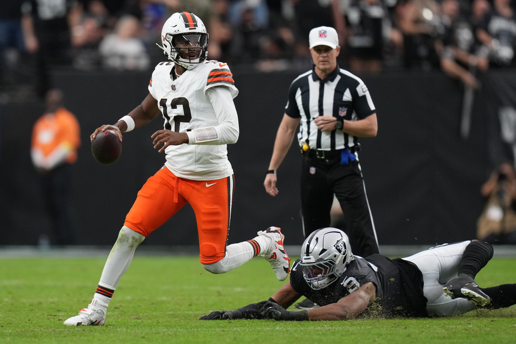 Las Vegas Raiders defensive end Tyree Wilson (9) pressures Cleveland Browns quarterback Shedeur Sanders (12) during the first half of an NFL football game Sunday, Nov. 23, 2025, in Las Vegas. (AP Photo/Eric Gay)