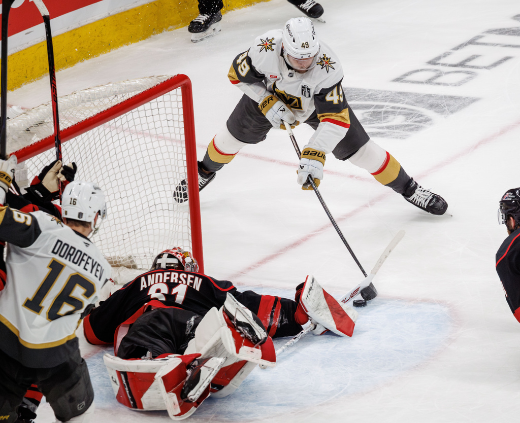 Carolina Hurricanes' Frederik Andersen (31) makes a save against Vegas Golden Knights' Ivan Barbashev (49) in the third period of Game 2 of the NHL hockey Stanley Cup Final series in Raleigh, N.C., Thursday, June 4, 2026. (AP Photo/Ben McKeown)