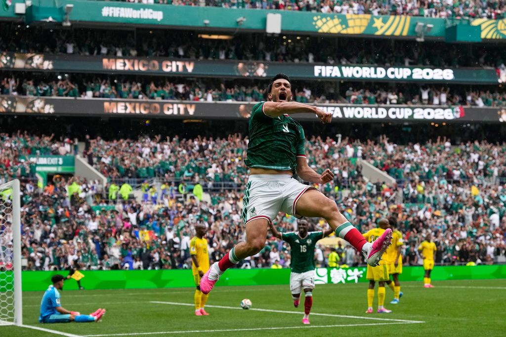 Mexico's Raul Jimenez celebrates after scoring his side's second goal during the World Cup Group A soccer match between Mexico and South Africa in Mexico City, Thursday, June 11, 2026. (AP Photo/Natacha Pisarenko)