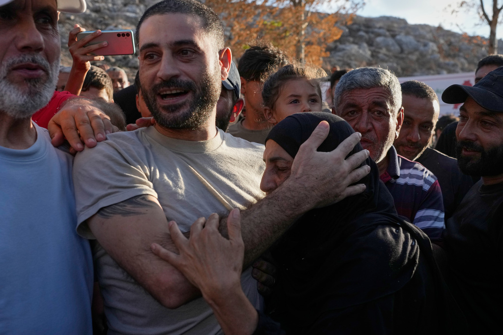 Hussein Ayash, who was released from an Israeli prison, hugs his mother as he arrives at his family home in the southern village of Harouf, Lebanon, Friday, Sept. 4, 2026. (AP Photo/Mohammed Zaatari)