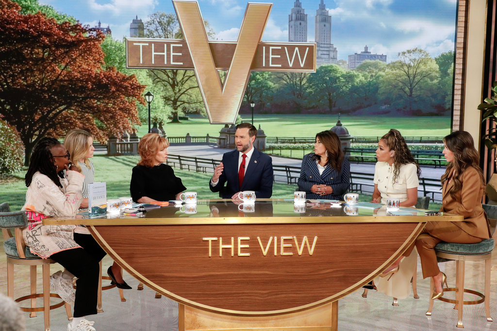 This image released by ABC shows Vice President JD Vance, center, with co-hosts, from left, Whoopi Goldberg, Sara Haines, Joy Behar, Ana Navarro, Sunny Hostin and Alyssa Farah Griffin during an appearance on "The View" in New York on Tuesday, June 16, 2026. (Lou Rocco/ABC via AP)