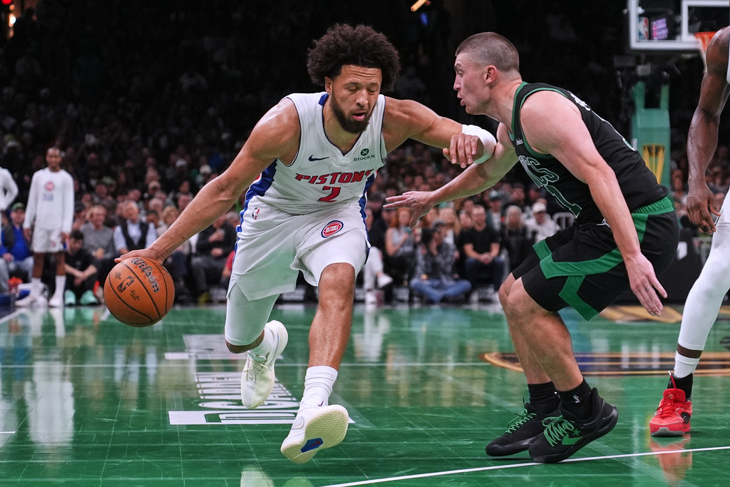 Detroit Pistons guard Cade Cunningham (2) drives to the basket against Boston Celtics guard Payton Pritchard, right, during the second half of an Emirates NBA Cup basketball game, Wednesday, Nov. 26, 2025, in Boston. (AP Photo/Charles Krupa)