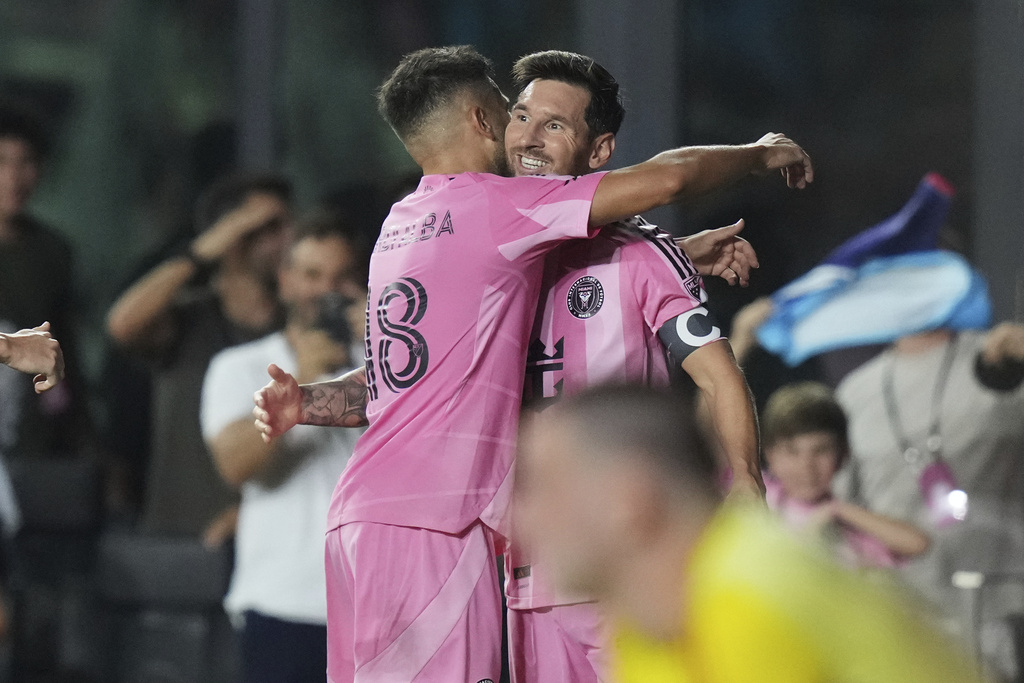 Inter Miami forward Lionel Messi, right, celebrates with defender Jordi Alba (18) after scoring a goal during the second half of an MLS soccer match against the Los Angeles Galaxy, Saturday, Aug. 16, 2025, in Fort Lauderdale, Fla. (AP Photo/Lynne Sladky)