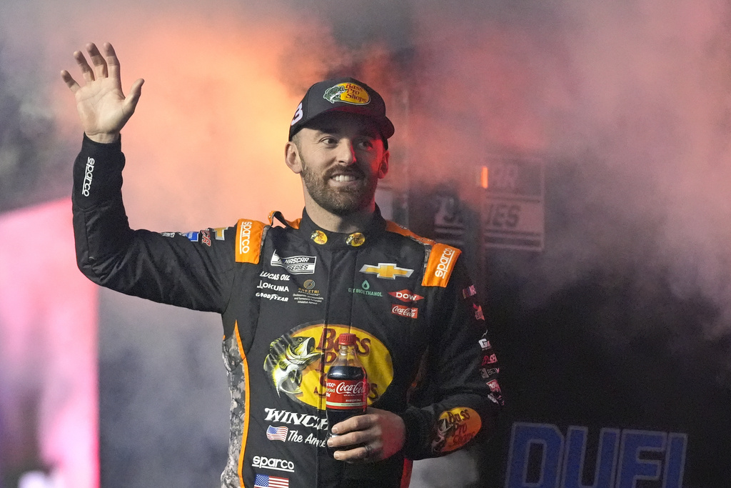 FILE - Austin Dillon waves during driver introductions before two NASCAR Daytona 500 qualifying auto races at Daytona International Speedway, Feb. 13, 2025, in Daytona Beach, Fla. (AP Photo/John Raoux, file)