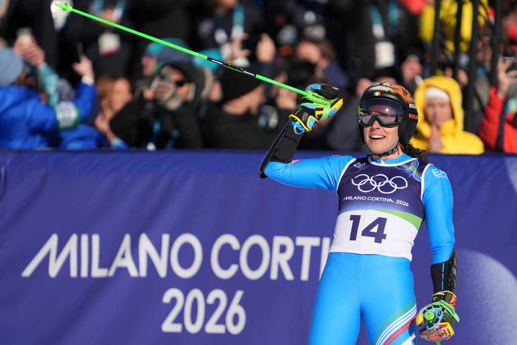 Italy's Federica Brignone celebrates at the finish area of an alpine ski, women's giant slalom race, at the 2026 Winter Olympics, in Cortina d'Ampezzo, Italy, Sunday, Feb. 15, 2026. (AP Photo/Jacquelyn Martin)