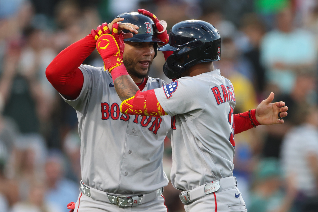 Boston Red Sox's Ceddanne Rafaela, right, celebrates with teammate Willson Contreras, left, after hitting a grand slam during the sixth inning of a baseball game against the Athletics, Monday, July 27, 2026, in West Sacramento, Calif. (AP Photo/Scott Marshall)
