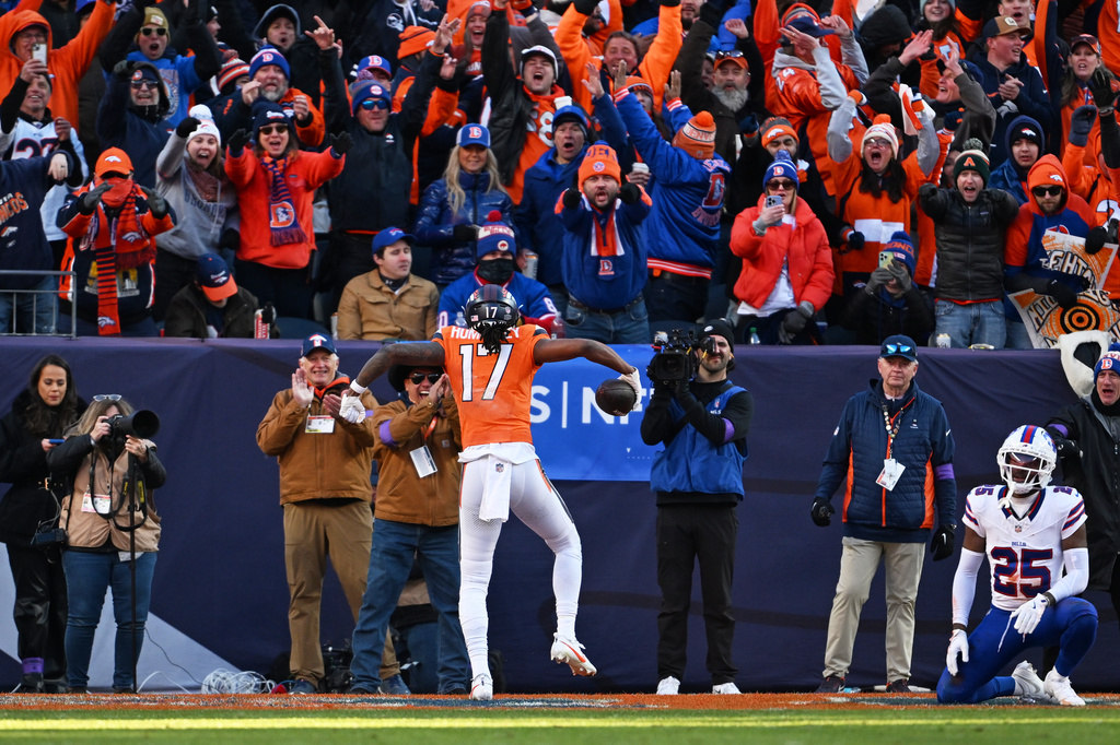 Denver Broncos wide receiver Lil'jordan Humphrey (17) celebrates after a touchdown during the first half of an NFL divisional round playoff football game against the Buffalo Bills, Saturday, Jan. 17, 2026, in Denver. (AP Photo/RJ Sangosti)