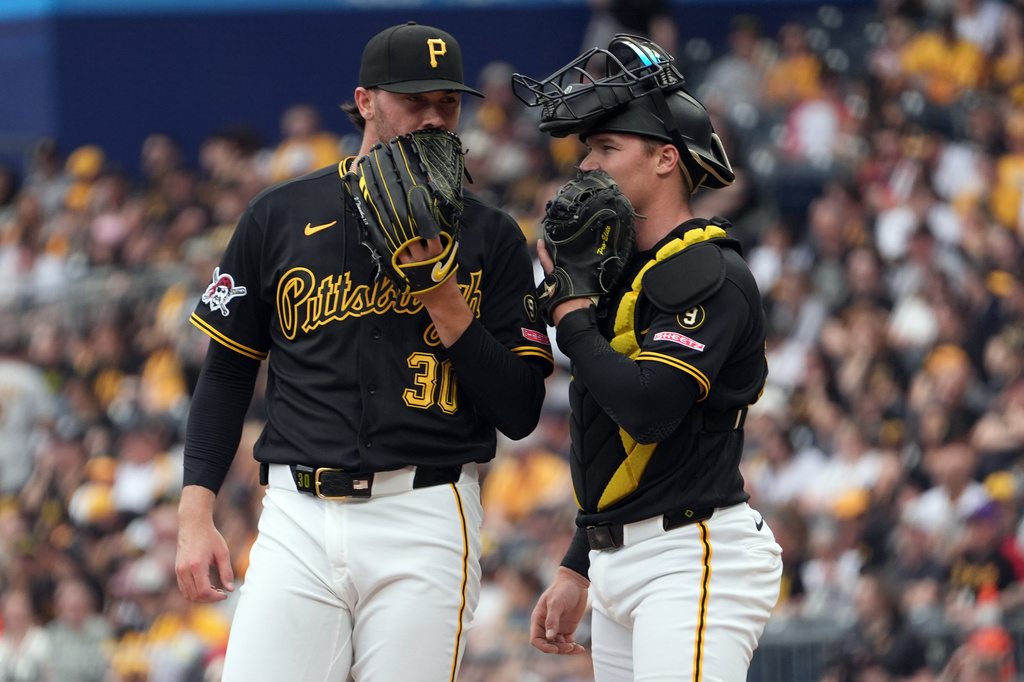 Pittsburgh Pirates pitcher Paul Skenes talks with catcher Henry Davis on the pitcher's mound against the Tampa Bay Rays in the second inning of a baseball game in Pittsburgh, Saturday, April 18, 2026. (AP Photo/Tom E. Puskar)