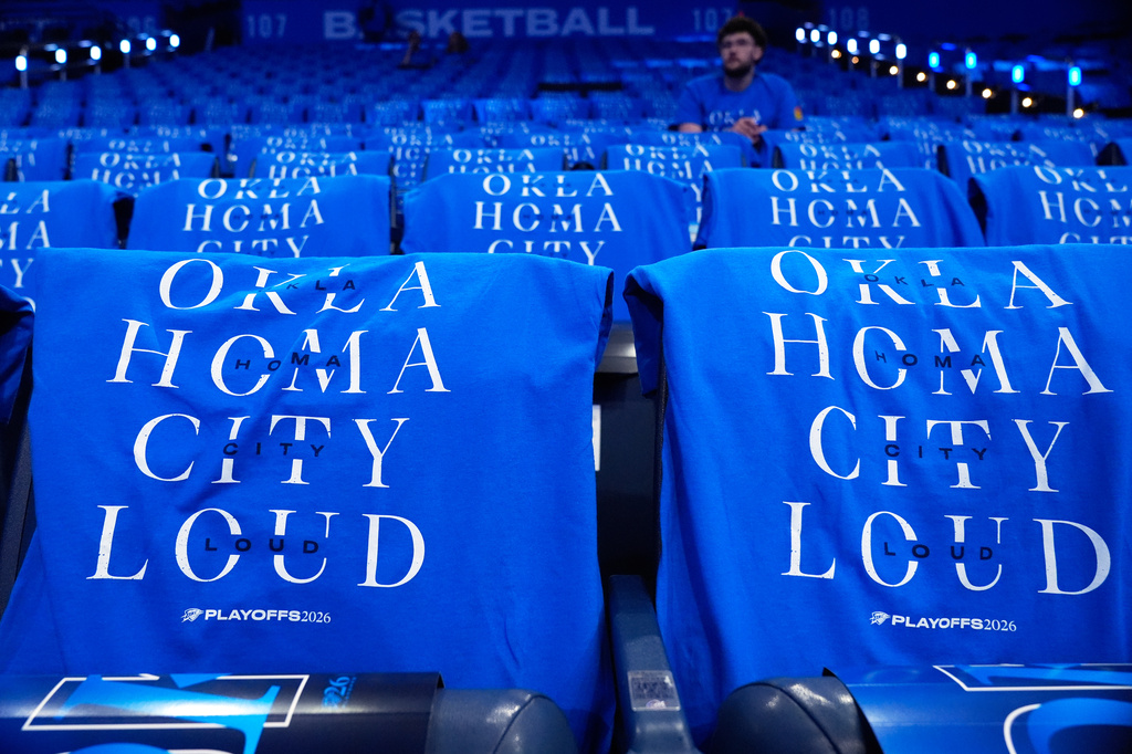T-shirts are draped on fan seats before Game 1 in a third-round NBA basketball playoffs series between the San Antonio Spurs and the Oklahoma City Thunder Monday, May 18, 2026, in Oklahoma City. (AP Photo/Tony Gutierrez)